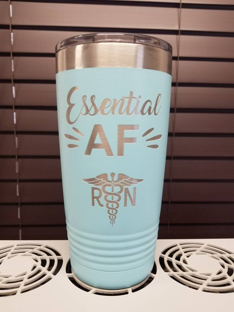 https://3cetching.com/wp-content/uploads/2020/09/essential-af-engraved-stainless-steel-nursing-tumbler-nurse-gift-funny-rn-mug-gift-5f5fb6bf.jpg