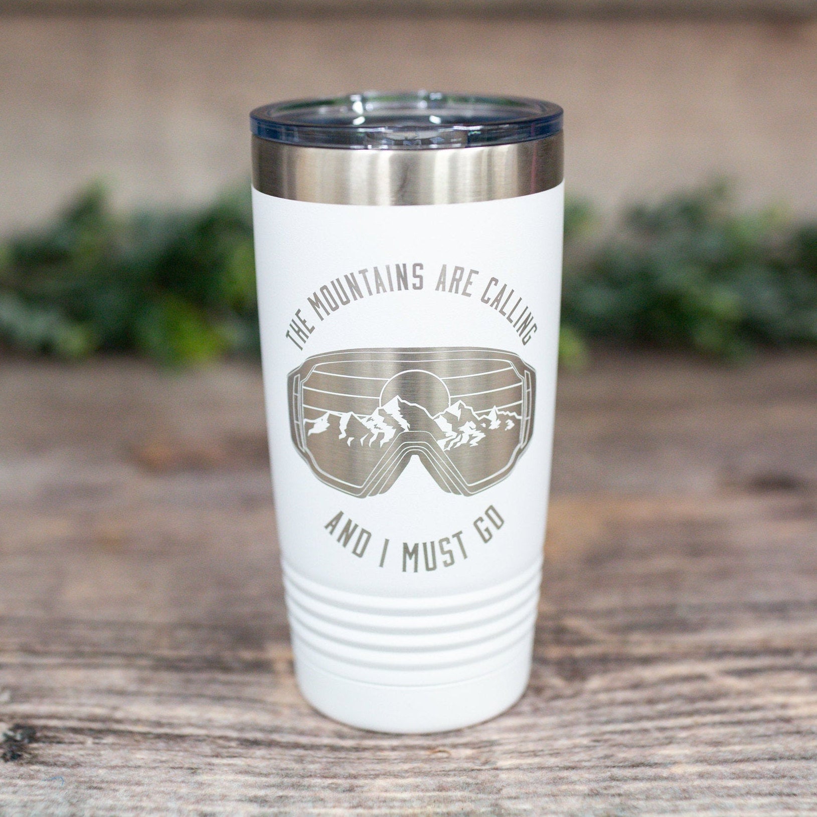https://3cetching.com/wp-content/uploads/2021/07/the-mountains-are-calling-and-i-must-go-engraved-stainless-winter-sports-tumbler-ski-mug-gift-for-skiers-60f739a7.jpg